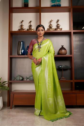 Attrective Looking This Fastivel Saree Are Fine Saree Paired With Blouse.This Saree And Blouse Are Kanjivaram Silk Based Fabric With Heavy Wevon Designer Work. Buy This Pretty Saree Now.
