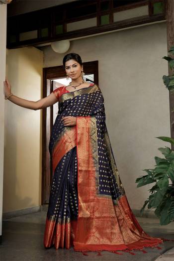 Garb This Traditional Saree Are Fine Saree Paired With Contrasted Blouse.This Saree And Blouse Are Dola Silk Based Fabric With Heavy Weaving Jari Designer Work. Buy This Pretty Saree Now.