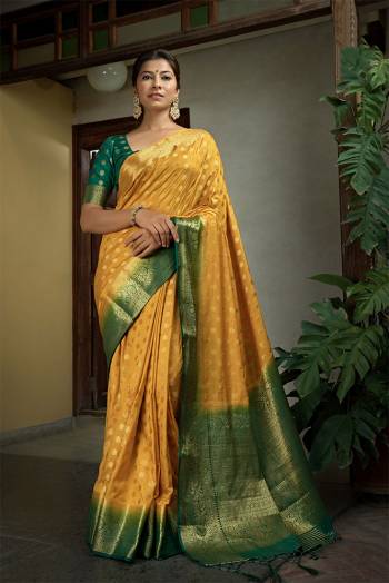 Garb This Traditional Saree Are Fine Saree Paired With Contrasted Blouse.This Saree And Blouse Are Dola Silk Based Fabric With Heavy Weaving Jari Designer Work. Buy This Pretty Saree Now.