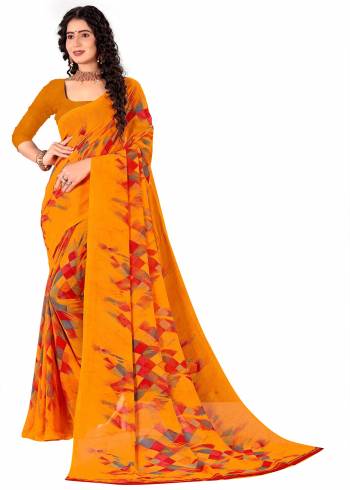 Garb This Saree Paired With Contrasted Blouse.This Saree And Blouse Are Georgette Based Fabric With Designer Printed. Buy This Pretty Saree Now.