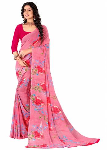 Garb This Saree Paired With Contrasted Blouse.This Saree And Blouse Are Georgette Based Fabric With Designer Printed. Buy This Pretty Saree Now.