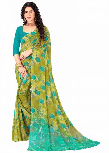 Garb This Saree Paired With Contrasted Blouse.This Saree And Blouse Are Georgette Based Fabric With Designer Printed. Buy This Pretty Saree Now.