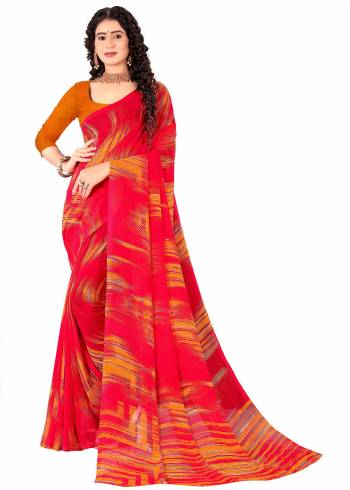 Garb This Saree Paired With Contrasted Blouse.This Saree And Blouse Are Georgette Based Fabric With Designer Printed. Buy This Pretty Saree Now.