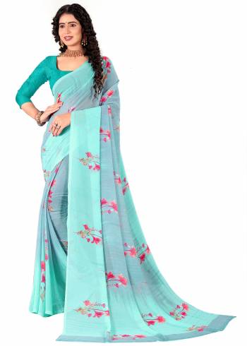 Garb This Saree Paired With Contrasted Blouse.This Saree And Blouse Are Georgette Based Fabric With Designer Printed. Buy This Pretty Saree Now.