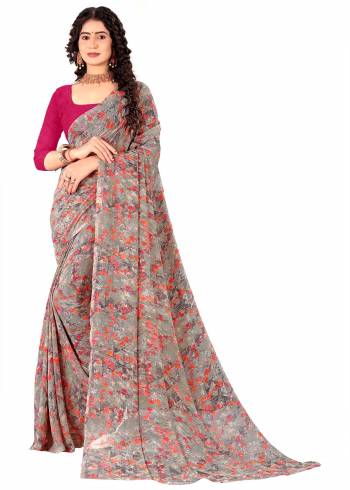 Garb This Saree Paired With Contrasted Blouse.This Saree And Blouse Are Georgette Based Fabric With Designer Printed. Buy This Pretty Saree Now.