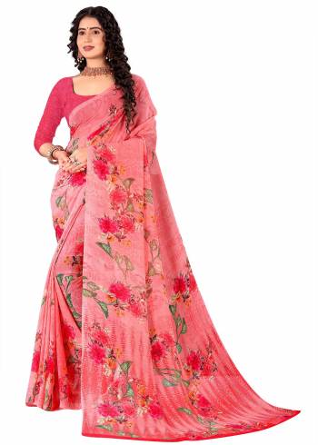 Garb This Saree Paired With Contrasted Blouse.This Saree And Blouse Are Georgette Based Fabric With Designer Printed. Buy This Pretty Saree Now.