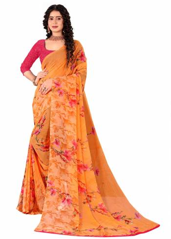 Garb This Saree Paired With Contrasted Blouse.This Saree And Blouse Are Georgette Based Fabric With Designer Printed. Buy This Pretty Saree Now.