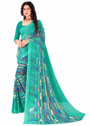 Garb This Saree Paired With Contrasted Blouse.This Saree And Blouse Are Georgette Based Fabric With Designer Printed. Buy This Pretty Saree Now.