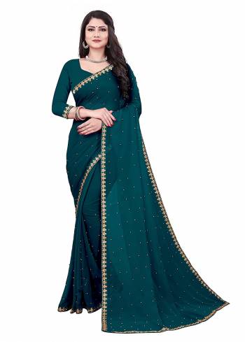 Grab This Designer Partywear Saree Are Pretty Color Paired With Lovely Blouse.This Saree Are Vichitra Silk And Blouse Are Benglori Silk Based Fabric With Designer Embroidery Lace Border With Moti Work. Buy This Pretty Saree Now.