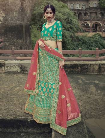 Look Attractive In This Designer Heavy Lehenga Choli In Ptrtty Color Paired?With Lovely Blouse And Dupatta. This Blouse And Lehenga Are Fabricated On Satin Paired With Soft Net Fabricated Dupatta. It Has Heavy Designer Glitter Dori,Jari With Thread Embroidery And Stone Work.Buy Now.