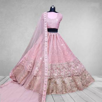 Here Is A Beautiful Heavy Designer Lehenga Choli In Pretty Color. Its Blouse And Lehenga Are Velvet Fabricated Paired With Net Fabricated Dupatta. Buy Now