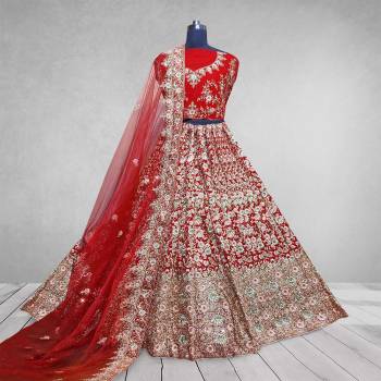 Here Is A Beautiful Heavy Designer Lehenga Choli In Pretty Color. Its Blouse And Lehenga Are Velvet Fabricated Paired With Net Fabricated Dupatta. Buy Now