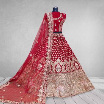 Here Is A Beautiful Heavy Designer Lehenga Choli In Pretty Color. Its Blouse And Lehenga Are Velvet Fabricated Paired With Net Fabricated Dupatta. Buy Now