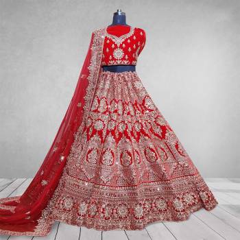 Here Is A Beautiful Heavy Designer Lehenga Choli In Pretty Color. Its Blouse And Lehenga Are Velvet Fabricated Paired With Net Fabricated Dupatta. Buy Now