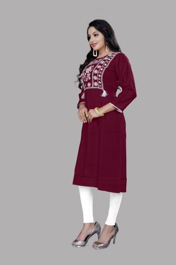 Grab This Readymade Long Kurti In Dark Color. This Kurti Is Ruby Cotton Blend Fabricated Beautified With Designer Lukhnovi Embroidery WorkWith Tussels. It Is Light In Weight And Easy To Carry All Day Long. 