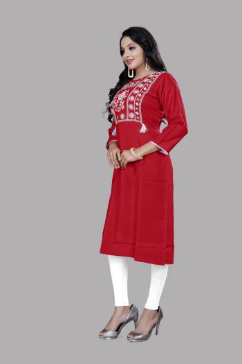 Grab This Readymade Long Kurti In Dark Color. This Kurti Is Ruby Cotton Blend Fabricated Beautified With Designer Lukhnovi Embroidery WorkWith Tussels. It Is Light In Weight And Easy To Carry All Day Long. 