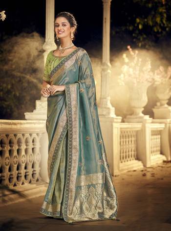 For A Royal And Beautiful Look, Grab This Beautifull Saree In Pretty Color Paired With Pretty Colored Blouse. This Saree Is Fabricated On Viscose Dola Silk Paired With Raw Silk Fabricated Blouse.