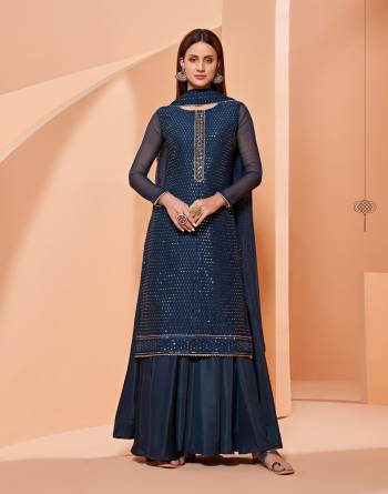 Grab These Designer Sharara Suits In Lovely Color.Its Pretty Designer Thread,Sequance Embroidery Work Top Is Georgette Based Paired Bottom Dull Santoon With Georgette Fabricated Dupatta Which Gives An Attractive To The Dress.Buy Now