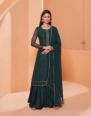 Grab These Designer Sharara Suits In Lovely Color.Its Pretty Designer Thread,Sequance Embroidery Work Top Is Georgette Based Paired Bottom Dull Santoon With Georgette Fabricated Dupatta Which Gives An Attractive To The Dress.Buy Now