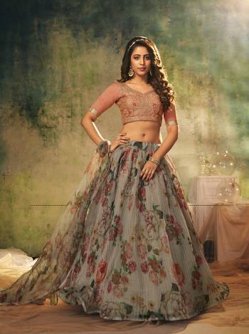 Look Attractive In This Designer Heavy Lehenga Choli In Pretty Color Paired With Lovely Blouse And Dupatta.Its Blouse is Banglori Silk And Lehenga And Dupatta Is Organza Based Fabric.Beautified With Sequance Embroidery Work,Digital Printed,Crushed Plated.