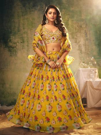 Look Attractive In This Designer Heavy Lehenga Choli In Pretty Color Paired With Lovely Blouse And Dupatta.Its Blouse is Banglori Silk And Lehenga And Dupatta Is Organza Based Fabric.Beautified With Sequance Embroidery Work,Digital Printed,Crushed Plated.