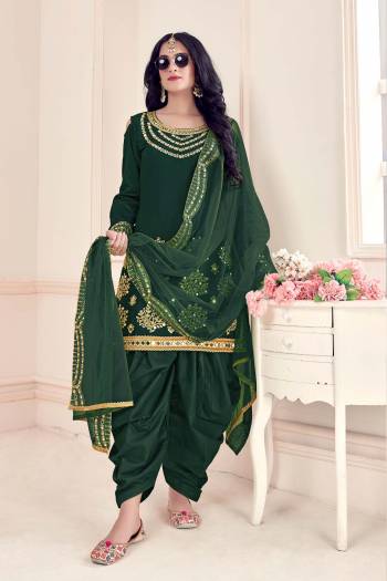 Enhance Your Personality Wearing This Designer Patiala Suit In Green Colored Top Paired With Matching Bottom And Dupatta.This Suit Is Bitalian Soft Silk Based Paired With Bitalian Soft Silkn Bottom And Net Dupatta. Buy Now