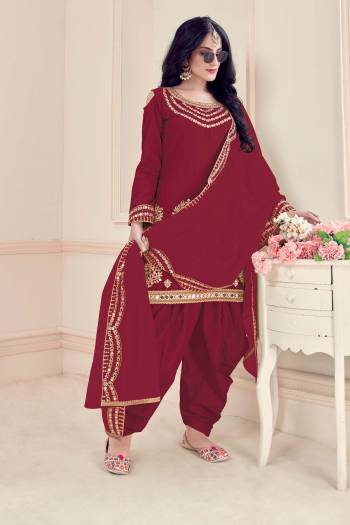 Enhance Your Personality Wearing This Designer Patiala Suit In Maroon Colored Top Paired With Matching Bottom And Dupatta.This Suit Is Bitalian Soft Silk Based Paired With Bitalian Soft Silkn Bottom And Net Dupatta. Buy Now