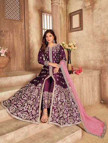 Get Ready For The Upcoming Festive And Wedding Season With This Designer Suit In Wine Color. This Suit Is Art Sllk Based Beautified With Heavy Real Mirror Embroidery Work All Over It. Buy Now