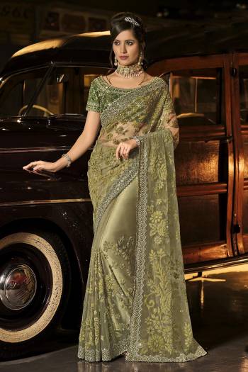 Every Girl And Woman dreams to wear a saree. A saree that would make her look youthful,fresh and subtle yet outstanding. This saree s Pretty Colored And Fabricated On Net And Beautified With Designer Work.