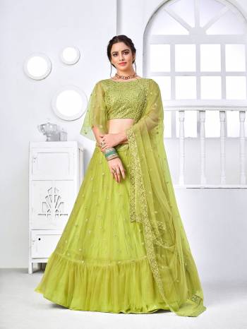 Look Attractive In This Designer Heavy Lehenga Choli In Pretty Color Paired With Lovely Blouse And Dupatta.Its Lehenga Is Net Based Fabric.Beautified With Heavy Thread,Sequance Embroidery Work.