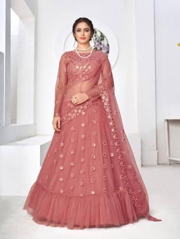 Look Attractive In This Designer Heavy Lehenga Choli In Pretty Color Paired With Lovely Blouse And Dupatta.Its Lehenga Is Net Based Fabric.Beautified With Heavy Thread,Sequance Embroidery Work.