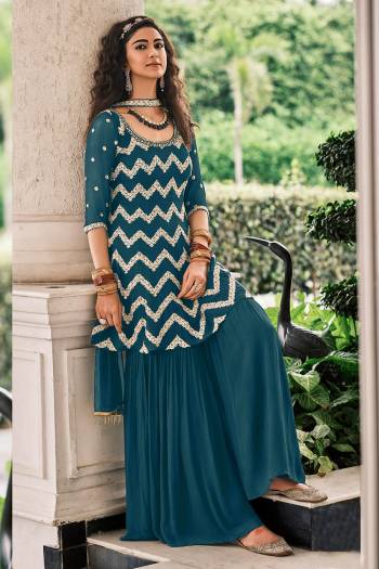 Grab These Designer Sharara Suits In Lovely Color.Top And Bottom Is Fabricated On Viscose Georgette Paired Soft Net Dupatta Which Gives An Attractive To The Suits.Buy Now