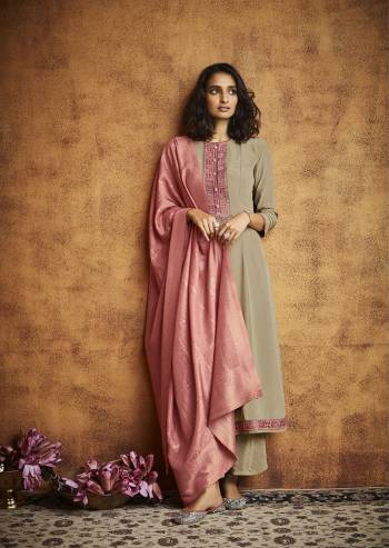 Here Is A Very Beautiful Readymade Designer Suit In Pretty Color Top is Fabricated On Fiyona Silk Pair With Fiyona Silk Bottom And Muslin Jacquard Dupatta Beautified With Embroidery,Hand Work And Wevon Designer