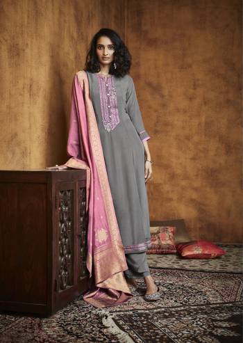 Here Is A Very Beautiful Readymade Designer Suit In Pretty Color Top is Fabricated On Fiyona Silk Pair With Fiyona Silk Bottom And Muslin Jacquard Dupatta Beautified With Embroidery,Hand Work And Wevon Designer