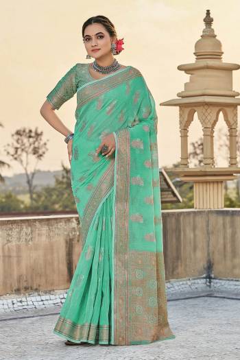 You Will Definitely Earn Lots Of Compliments Wearing This Pretty Elegant Looking Saree In Pretty Color Paired With Matching Colored Blouse.This Saree and Blouse Are Fabricated On Cotton. It Is Beautified With Printed Designer Weaving Work