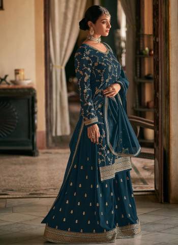 Here Is A Very Beautiful Designer Suit In Pretty Color Top is Fabricated On Georgette Pair With Readymade Georgette Bottom And Georgette Dupatta Beautified With Heavy Jari Embroidery Work