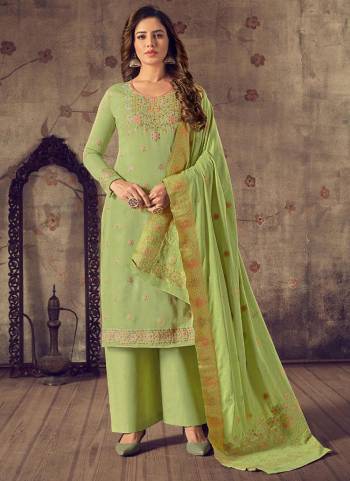 Here Is A Very Beautiful Designer Suit In Pretty Color Top is Fabricated On Cotton Pair With Jam Satin Bottom And Bemberg Chiffon Dupatta Beautified With Wevon Jacquard Designer,Hand Work