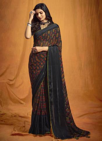 Grab These Lovely Saree In Black Colored Pair With Black Blouse.Saree And Blouse Are Fabricated On Georgette Beautified With Digital Printed