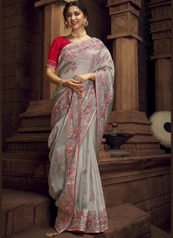 You Will Definitely Earn Lots Of Compliments Wearing This Pretty Elegant Looking Saree In Pretty Color Paired With Contrast Colored Blouse.This Saree is fabricated on Organza Pair With Art Silk Blouse.Beautified With Heavy Designer Embroidery,Stone Work