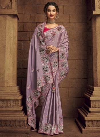 You Will Definitely Earn Lots Of Compliments Wearing This Pretty Elegant Looking Saree In Pretty Color Paired With Contrast Colored Blouse.This Saree is fabricated on Organza Pair With Art Silk Blouse.Beautified With Heavy Designer Embroidery,Stone Work