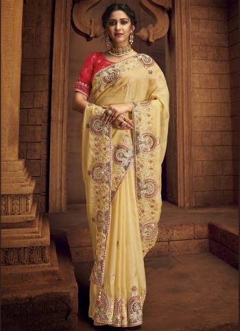 You Will Definitely Earn Lots Of Compliments Wearing This Pretty Elegant Looking Saree In Pretty Color Paired With Contrast Colored Blouse.This Saree is fabricated on Organza Pair With Art Silk Blouse.Beautified With Heavy Designer Embroidery,Stone Work