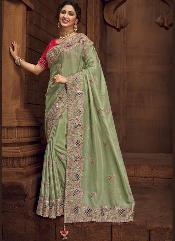 You Will Definitely Earn Lots Of Compliments Wearing This Pretty Elegant Looking Saree In Pretty Color Paired With Contrast Colored Blouse.This Saree is fabricated on Organza Pair With Art Silk Blouse.Beautified With Heavy Designer Embroidery,Stone Work