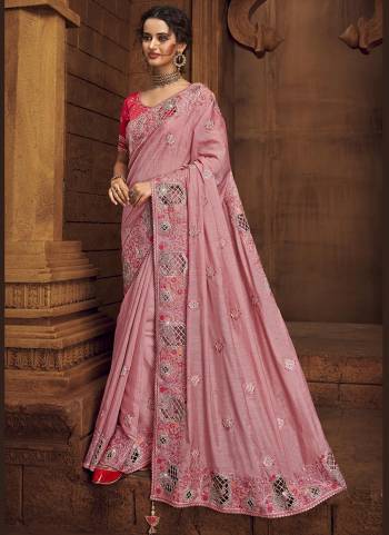 You Will Definitely Earn Lots Of Compliments Wearing This Pretty Elegant Looking Saree In Pretty Color Paired With Contrast Colored Blouse.This Saree is fabricated on Organza Pair With Art Silk Blouse.Beautified With Heavy Designer Embroidery,Stone Work