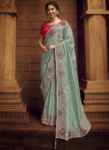 You Will Definitely Earn Lots Of Compliments Wearing This Pretty Elegant Looking Saree In Pretty Color Paired With Contrast Colored Blouse.This Saree is fabricated on Organza Pair With Art Silk Blouse.Beautified With Heavy Designer Embroidery,Stone Work