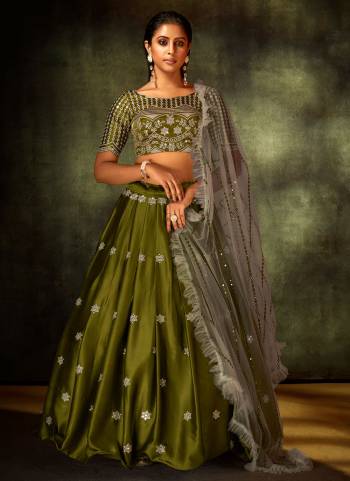 For A Rich And Subtle Look, Grab This Designer Lehenga In Green Colored Pair With Blouse And Grey Dupatta. It Has Very Beautiful Pattern With Heavy Thread,Sequance Embroidery Work