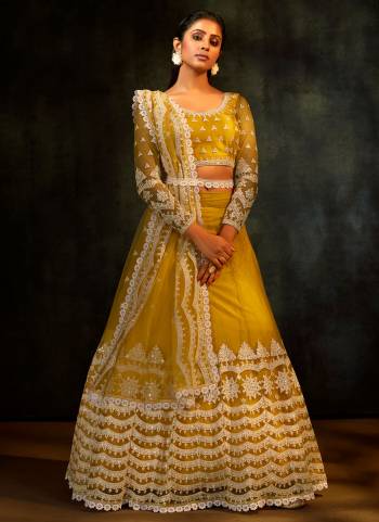 For A Rich And Subtle Look, Grab This Designer Lehenga In Yellow Colored Pair With Blouse And Dupatta. It Has Very Beautiful Pattern With Heavy Thread,Sequance Embroidery Work