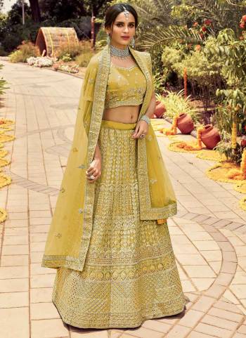 Catch All The Limelight At The Next Wedding You Attend Wearing This Heavy Designer Lehenga Choli In Pretty Colored Blouse Paired With Ptrtty Colored Lehenga And Dupatta. Its Pretty Embroidered Blouse And Dupatta Are Fabricated on Soft Net Paired With Embroidered Organza Fabricated Lehenga And Blouse.