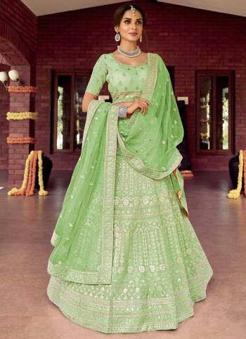 Catch All The Limelight At The Next Wedding You Attend Wearing This Heavy Designer Lehenga Choli In Pretty Colored Blouse Paired With Ptrtty Colored Lehenga And Dupatta. Its Pretty Embroidered Blouse And Dupatta Are Fabricated on Soft Net Paired With Embroidered Organza Fabricated Lehenga And Blouse.