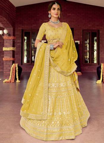 Catch All The Limelight At The Next Wedding You Attend Wearing This Heavy Designer Lehenga Choli In Pretty Colored Blouse Paired With Ptrtty Colored Lehenga And Dupatta. Its Pretty Embroidered Blouse And Dupatta Are Fabricated on Soft Net Paired With Embroidered Organza Fabricated Lehenga And Blouse.