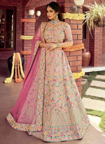 Catch All The Limelight At The Next Wedding You Attend Wearing This Heavy Designer Lehenga Choli In Pretty Colored Blouse Paired With Ptrtty Colored Lehenga And Dupatta. Its Pretty Embroidered Blouse And Dupatta Are Fabricated on Soft Net Paired With Embroidered Organza Fabricated Lehenga And Blouse.